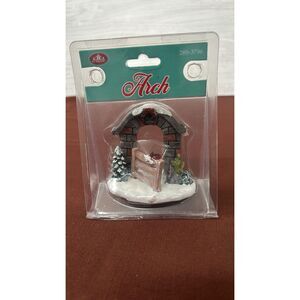 Square Christmas Village Gated Stone Arch Red Bow  On Wreath Snow